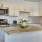 Kitchen with small island and pendent lighting.