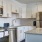 Kitchen with small island and pendent lighting.