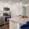 Kitchen with small island and pendent lighting.