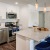 Kitchen with small island and pendent lighting.