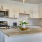 Kitchen with small island and pendent lighting.
