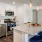 Kitchen with small island and pendent lighting.