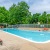 Large pool with poolside lounge chairs